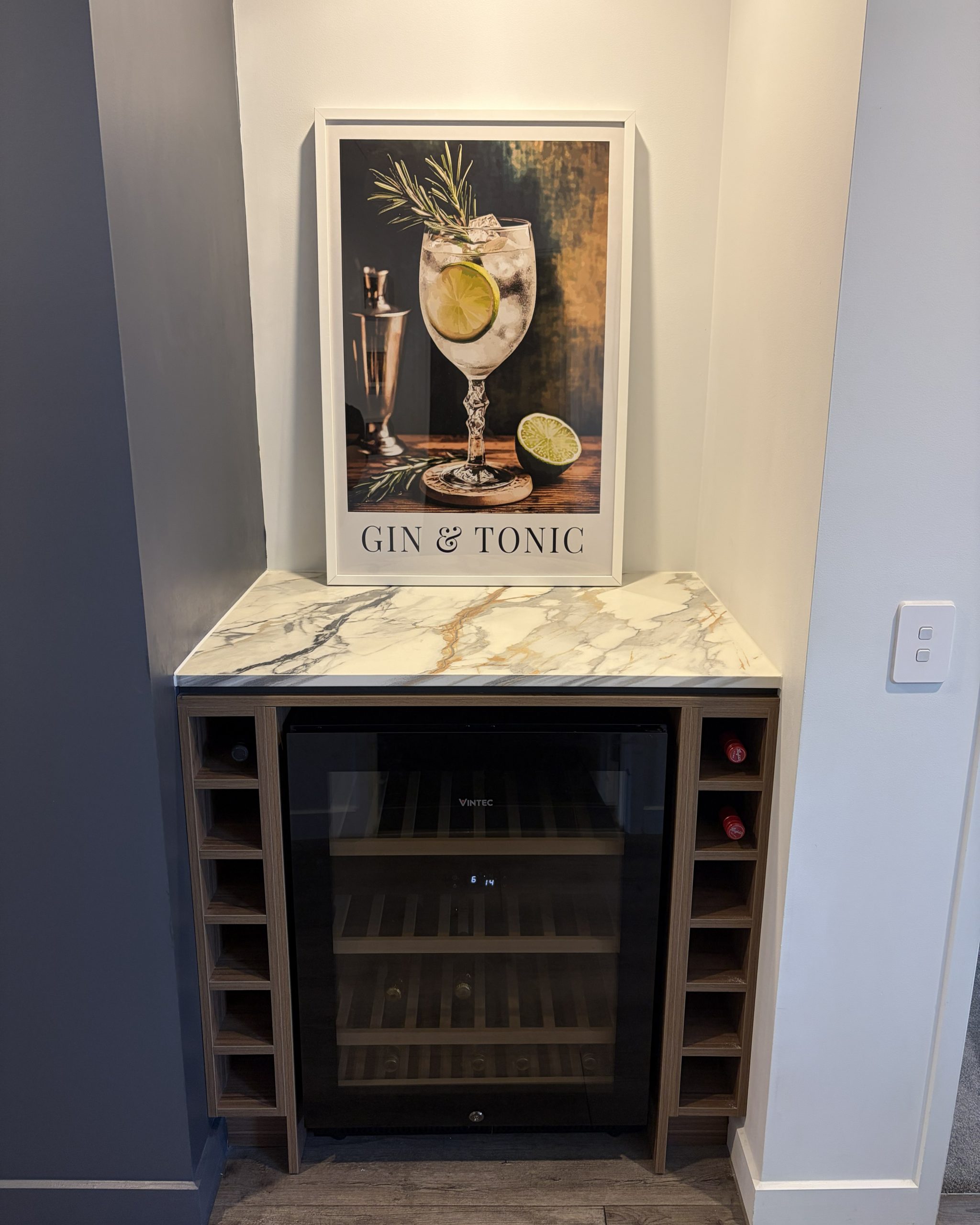 Custom drinks station with engineered stone surface, warm timber detailing and integrated wine storage — Brisbane joinery design by Zander Edward